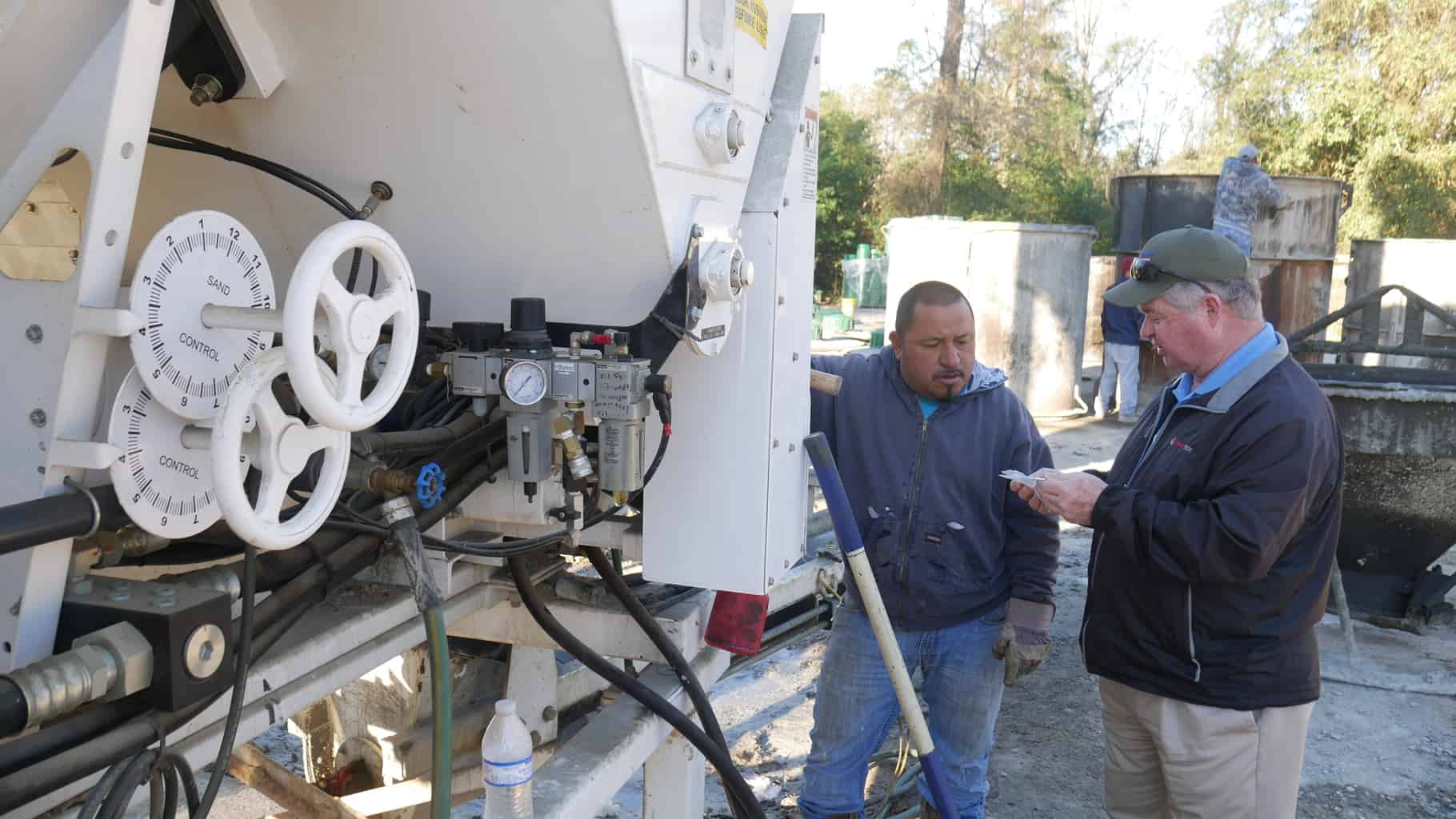 Calibrating a stationary concrete mixer at Whitley's Concrete Products.